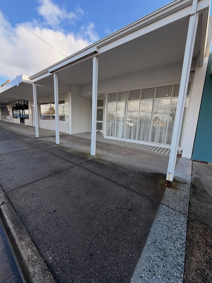 A concrete footpath under the verandah of a Ballarat shopfront
