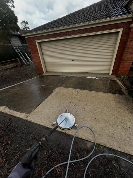 A surface cleaner and wand on a driveway at a Ballarat brick home