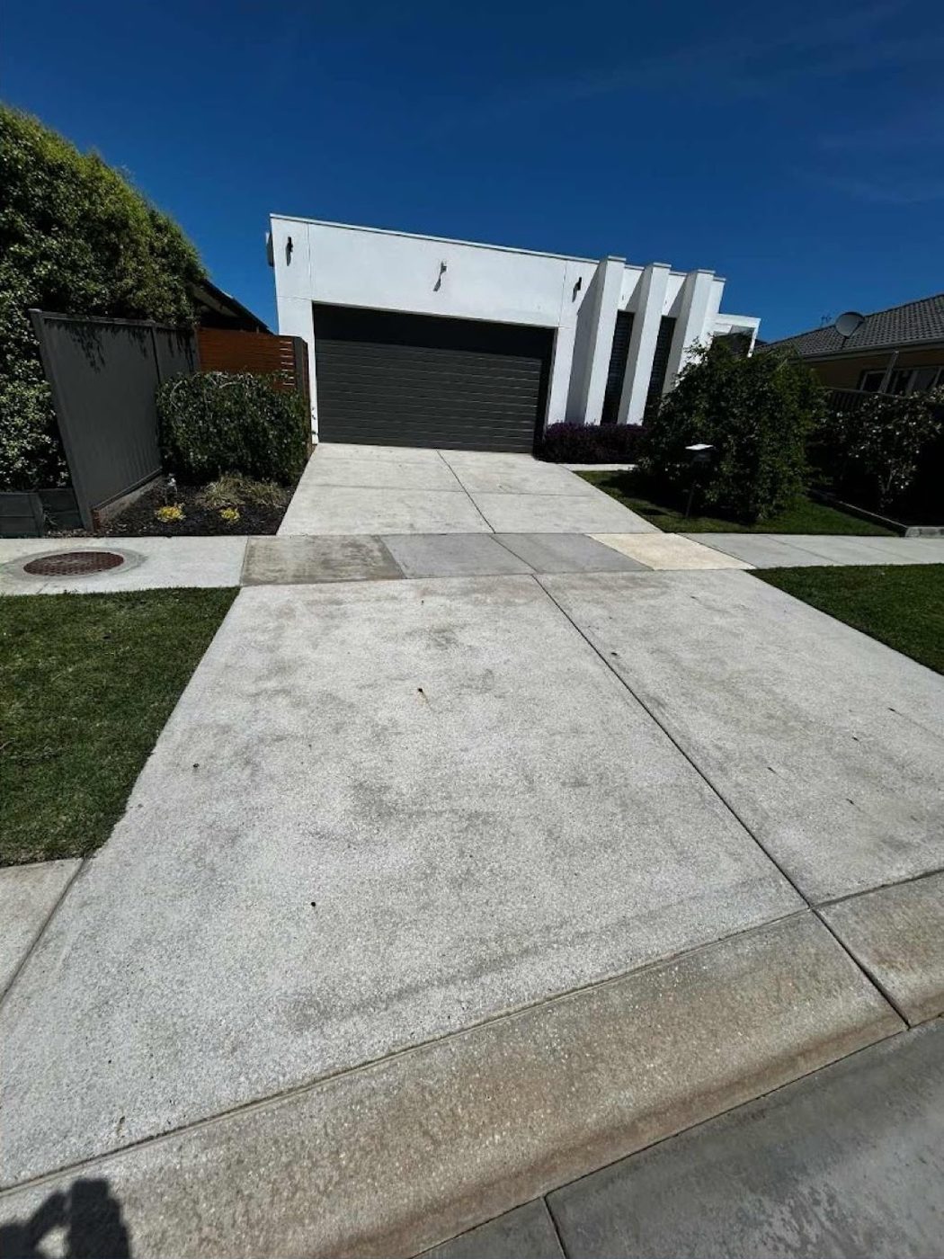 A concrete driveway at a Ballarat home after pressure washing