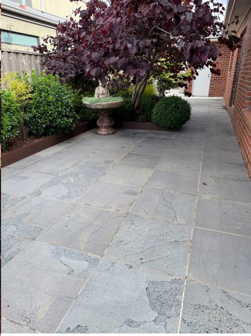 A bluestone courtyard cleaned by SCY Wash Pro